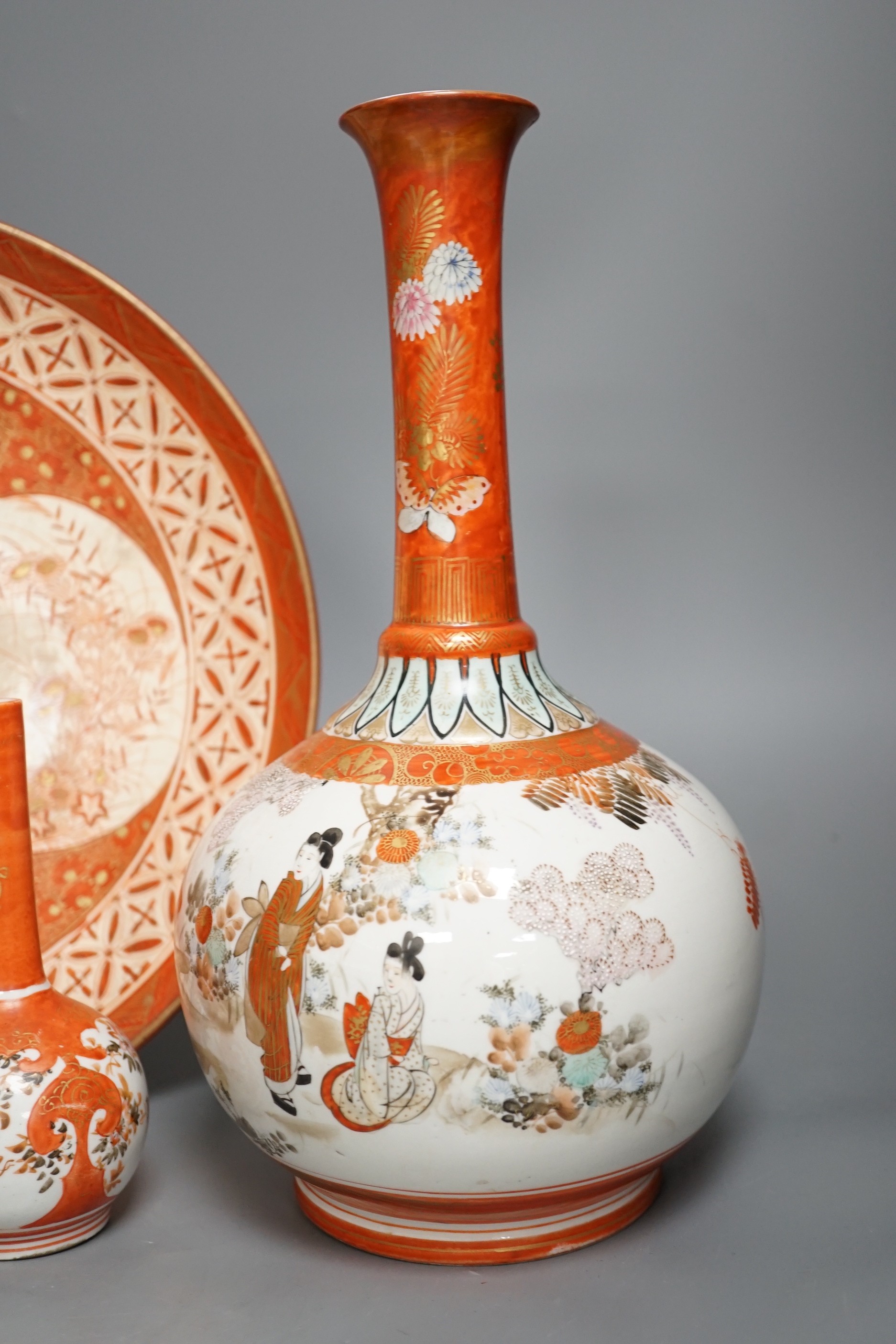 A 19th century Kutani bottle vase, a pair of smaller, similar vases and a large dish (4). Bottle vase 31cms high.